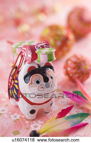 Stock Photo - Papier-mâché dog and temari ball. Fotosearch