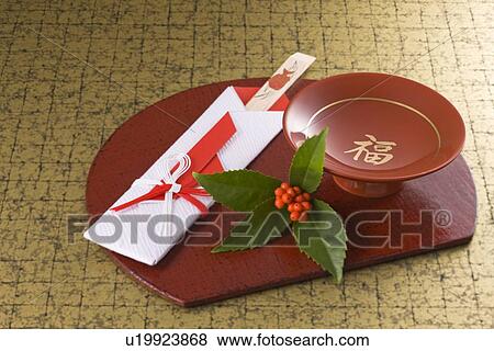 Stock Photo - Sake cup and chopsticks on tray. Fotosearch