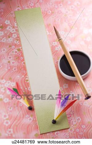 Stock Photo - Strip of paper and calligraphy brush. Fotosearch