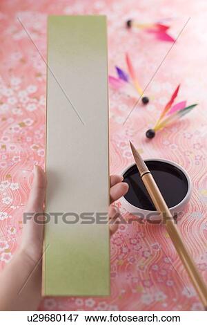 Strip of paper and calligraphy brush View Large Photo Image Stock Photo - Strip of paper and calligraphy brush. Fotosearch