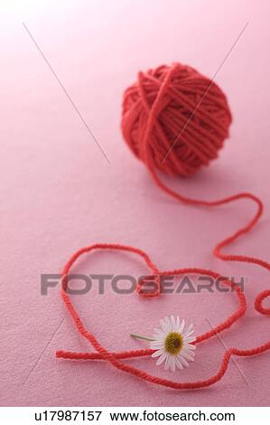Stock Photo - Heart shape made by wool. Fotosearch