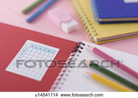 Picture - Notebook and colored pencil. Fotosearch