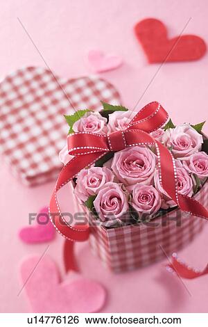 Pink rose in heart shaped box View Large Photo Image Stock Photograph - Pink rose in heart shaped box. Fotosearch