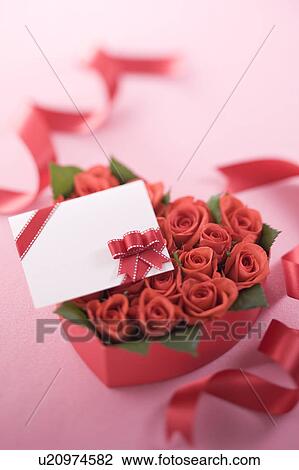 Red rose in heart shaped box and message card View Large Photo Image Stock Image - Red rose in heart shaped box and message card. Fotosearch