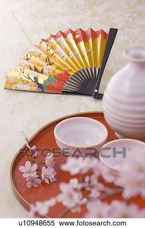 Sake bottle and cherry blossoms View Large Photo Image Stock Photography - Sake bottle and cherry blossoms. Fotosearch