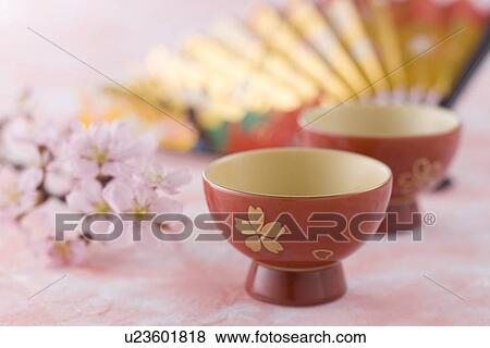 Stock Photo - Sake cup and fan. Fotosearch
