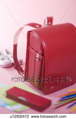 Stock Image - School bag and stationery. Fotosearch