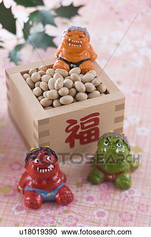 Stock Image - Soybean and ornament of evil. Fotosearch