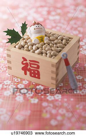 Stock Image - Soybean and ornament of evil. Fotosearch