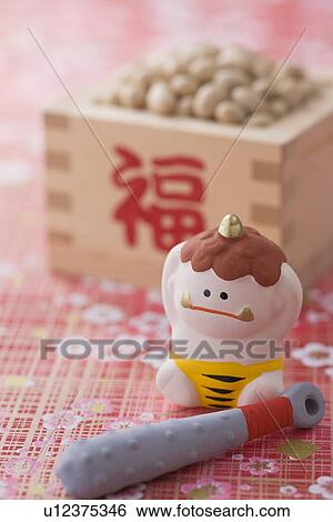 Stock Photograph - Soybean and ornament of evil. Fotosearch
