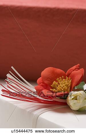 Stock Photography - Gift box and camellia. Fotosearch
