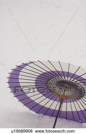Paper umbrella on snowfield View Large Photo Image Stock Photo - Paper umbrella on snowfield. Fotosearch