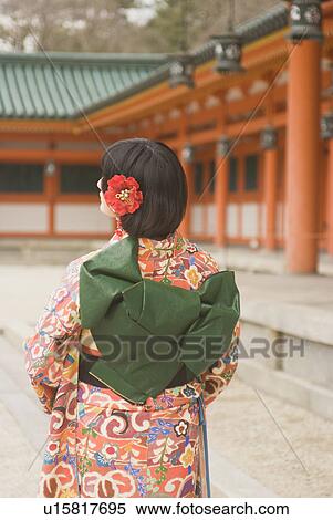 Stock Photography - Young woman at shrine. Fotosearch