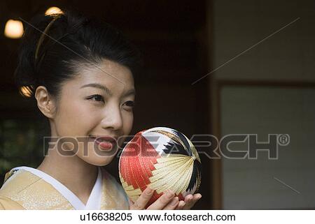 Young woman in kimono holding temari ball View Large Photo Image Stock Photography - Young woman in kimono holding temari ball. Fotosearch