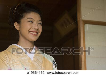 Young woman in kimono View Large Photo Image Stock Image - Young woman in kimono. Fotosearch
