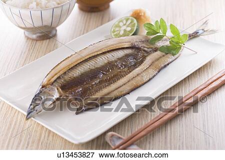 Stock Photo - Grilled saury. Fotosearch