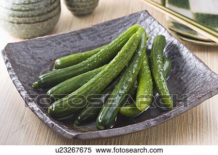 Stock Photography - Mini cucumber pickles. Fotosearch
