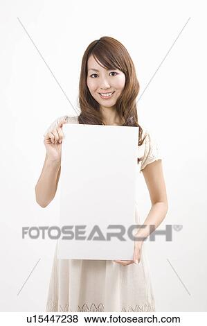 Young woman holding message board View Large Photo Image Stock Photo - Young woman holding message board. Fotosearch