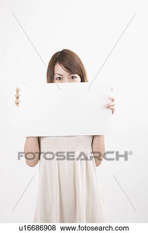 Stock Photo - Young woman holding message board. Fotosearch