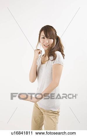 Stock Image - Young woman posing. Fotosearch