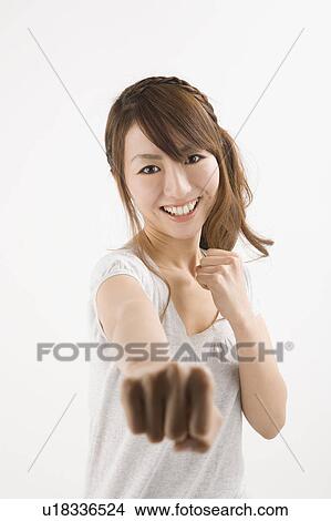 Young woman punching View Large Photo Image Picture - Young woman punching. Fotosearch
