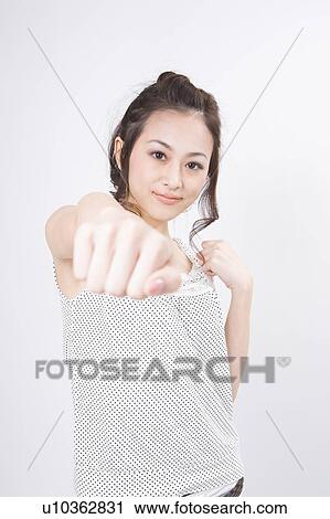 Young woman punching View Large Photo Image Stock Image - Young woman punching. Fotosearch