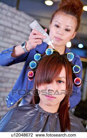 Hairdresser curling customer's hair, Hair Salon View Large Photo Image Stock Image - Hairdresser curling customer's hair, Hair Salon. Fotosearch