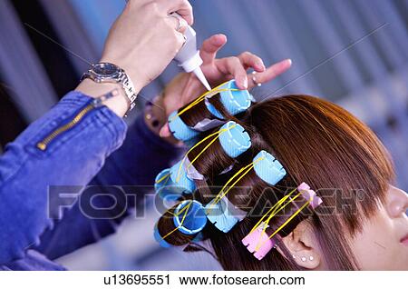 Hairdresser curling customer's hair, Hair Salon View Large Photo Image Stock Image - Hairdresser curling customer's hair, Hair Salon. Fotosearch