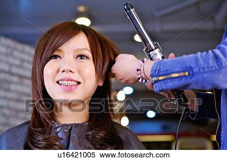 Young woman having her hair curling, Hair Salon View Large Photo Image Stock Photography - Young woman having her hair curling, Hair Salon. Fotosearch