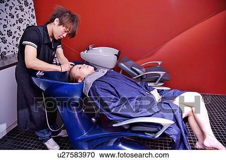 Young woman having her hair washed, Hair Salon View Large Photo Image Stock Image - Young woman having her hair washed, Hair Salon. Fotosearch