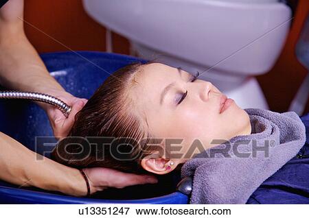 Young woman having her hair washed, Hair Salon View Large Photo Image Stock Photo - Young woman having her hair washed, Hair Salon. Fotosearch