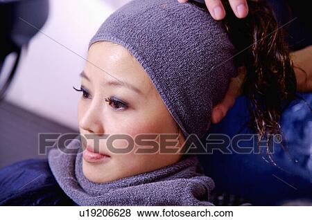 Young woman having her hair washed, Hair Salon View Large Photo Image Stock Photo - Young woman having her hair washed, Hair Salon. Fotosearch