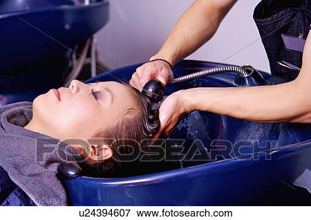 Young woman having her hair washed, Hair Salon View Large Photo Image Stock Photo - Young woman having her hair washed, Hair Salon. Fotosearch