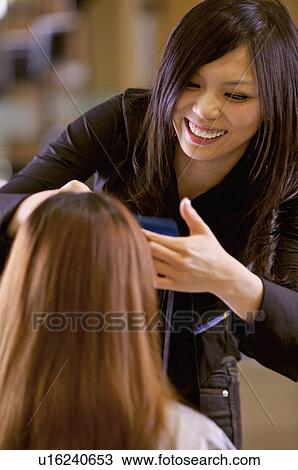 Hairdresser cutting customer's hair, Hair Salon View Large Photo Image Stock Image - Hairdresser cutting customer's hair, Hair Salon. Fotosearch