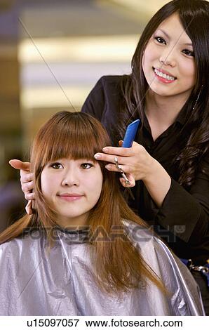Hairdresser giving advice for customer's hair, Hair Salon View Large Photo Image Stock Photo - Hairdresser giving advice for customer's hair, Hair Salon. Fotosearch