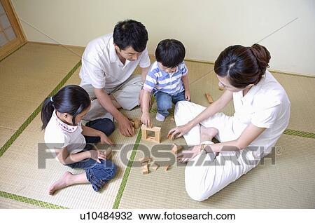 Family, family playing block game together View Large Photo Image Stock Image - Family, family playing block game together. Fotosearch