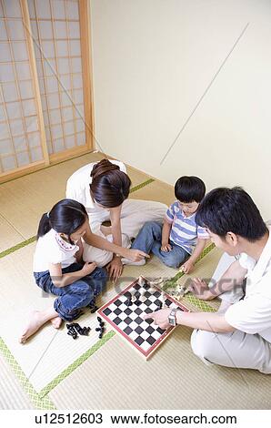 Stock Image - Family, family playing chess. Fotosearch
