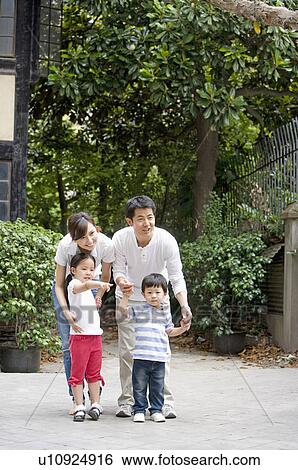 Family, family standing in front of a courtyard View Large Photo Image Stock Photograph - Family, family standing in front of a courtyard. Fotosearch