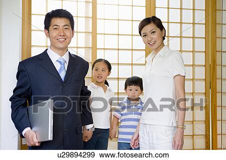Family, Family with two children standing together, father ready to work View Large Photo Image Stock Photo - Family, Family with two children standing together, father ready to work. Fotosearch