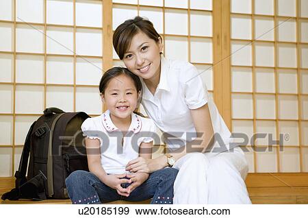 Family, mother and daughter smiling at camera View Large Photo Image Stock Photo - Family, mother and daughter smiling at camera. Fotosearch