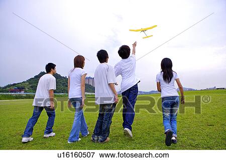 Five teenagers standing on the lawn and looking up, Teenager View Large Photo Image Stock Photo - Five teenagers standing on the lawn and looking up, Teenager. Fotosearch