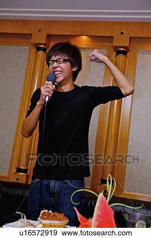 Stock Photo - Teenager boy singing with ecstatic facial expression, Teenager. Fotosearch