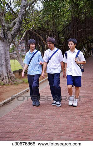 Stock Photograph - Teenager boys walking on the campus together, Teenager. Fotosearch