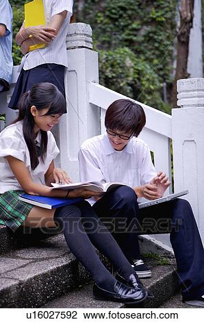 Teenagers sitting on the stairs and discussing together, Teenager View Large Photo Image Stock Image - Teenagers sitting on the stairs and discussing together, Teenager. Fotosearch