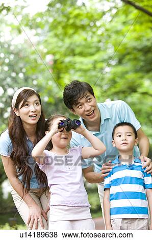 Young family with two children looking away with telescope, Family, Leisure Activities View Large Photo Image Stock Photo - Young family with two children looking away with telescope, Family, Leisure Activities. Fotosearch