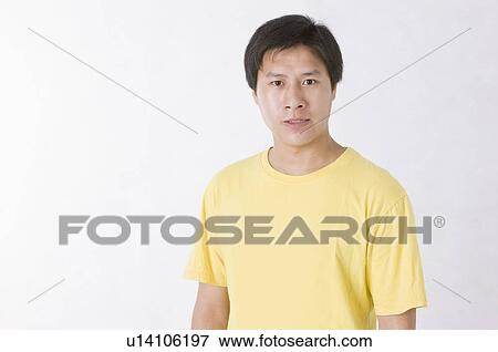 Stock Photo - Portrait of displeased man, Men, Facial Expression. Fotosearch