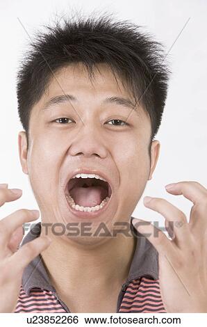 Portrait of man fearing with mouth opened, Facial Expression View Large Photo Image Stock Photograph - Portrait of man fearing with mouth opened, Facial Expression. Fotosearch