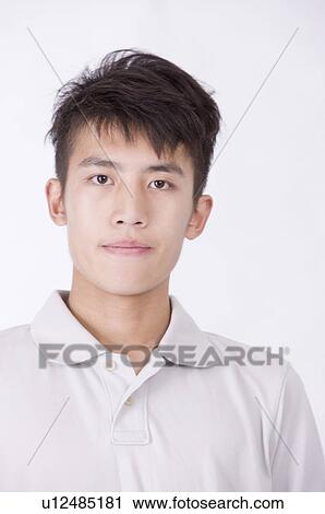 Stock Image - Portrait of man looking at the camera, Men, Facial Expression. Fotosearch