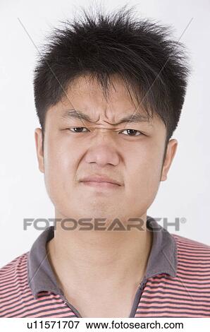 Portrait of man sulking and frowning, Men, Facial Expression View Large Photo Image Stock Photo - Portrait of man sulking and frowning, Men, Facial Expression. Fotosearch