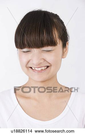 Portrait of woman laughing with eyes closed, Women, Facial Expression View Large Photo Image Picture - Portrait of woman laughing with eyes closed, Women, Facial Expression. Fotosearch